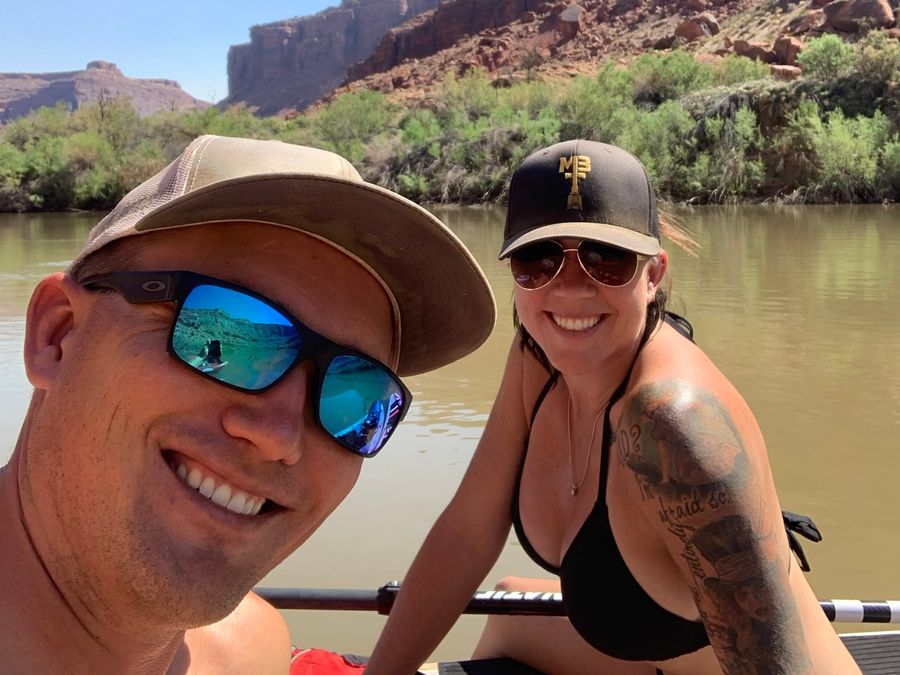 Shalee Holland and her husband Gavin paddleboarding on the Colorado River near Moab