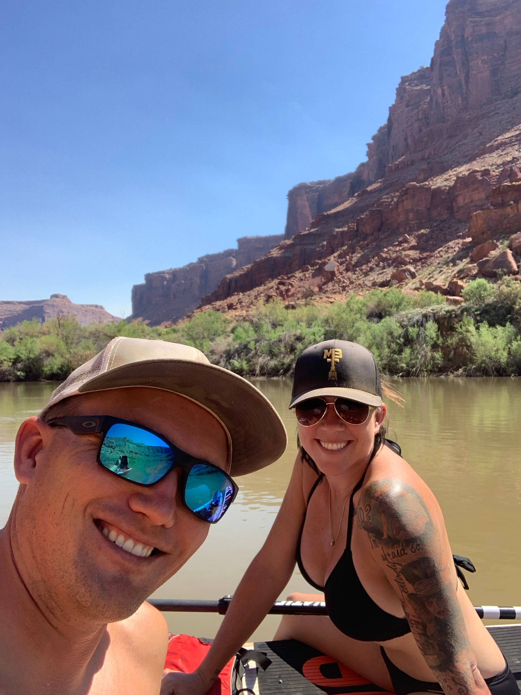 Shalee Holland and her husband Gavin paddleboarding on the Colorado River near Moab