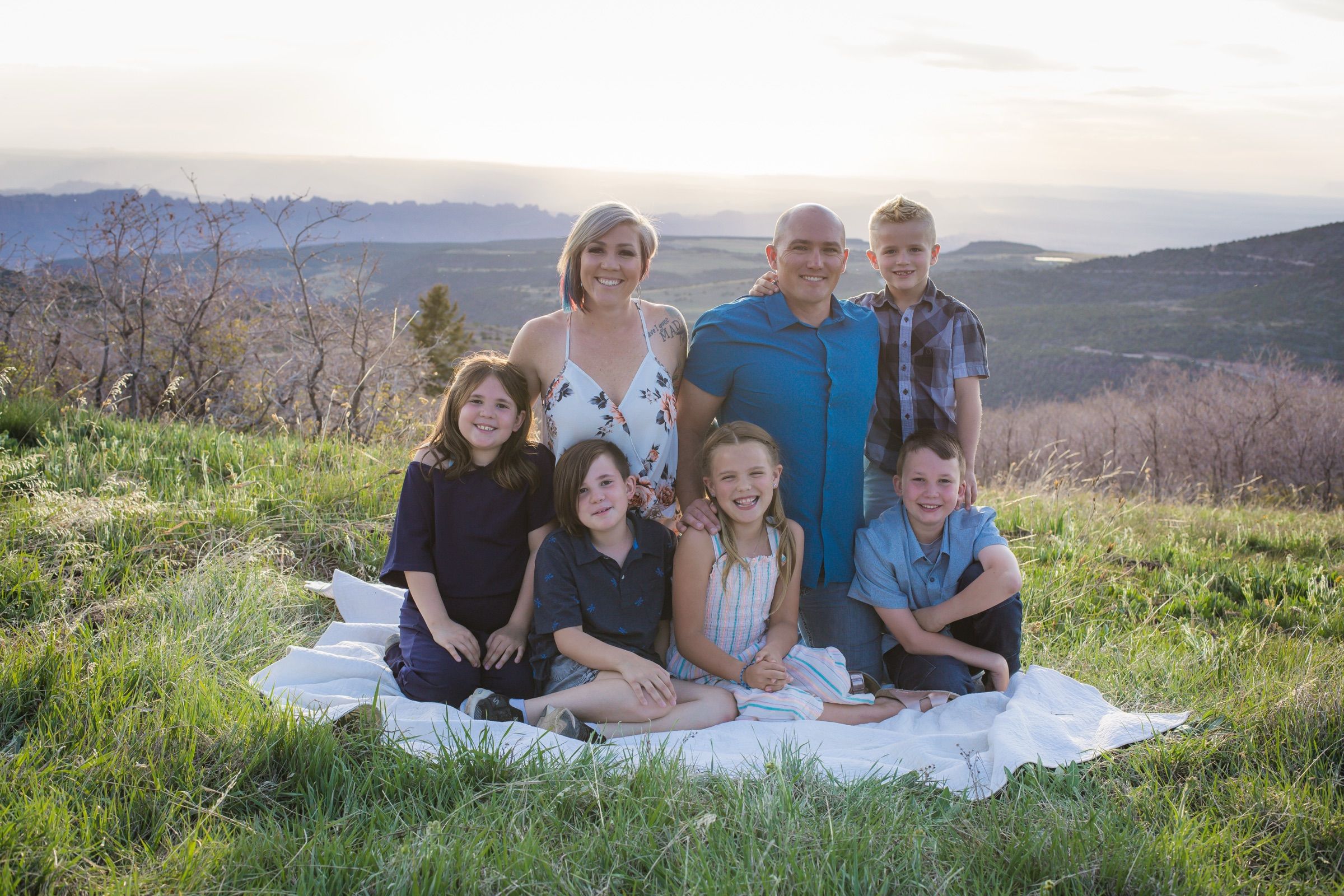 Shalee Holland with her husband Gavin and their five children in the mountains above Moab