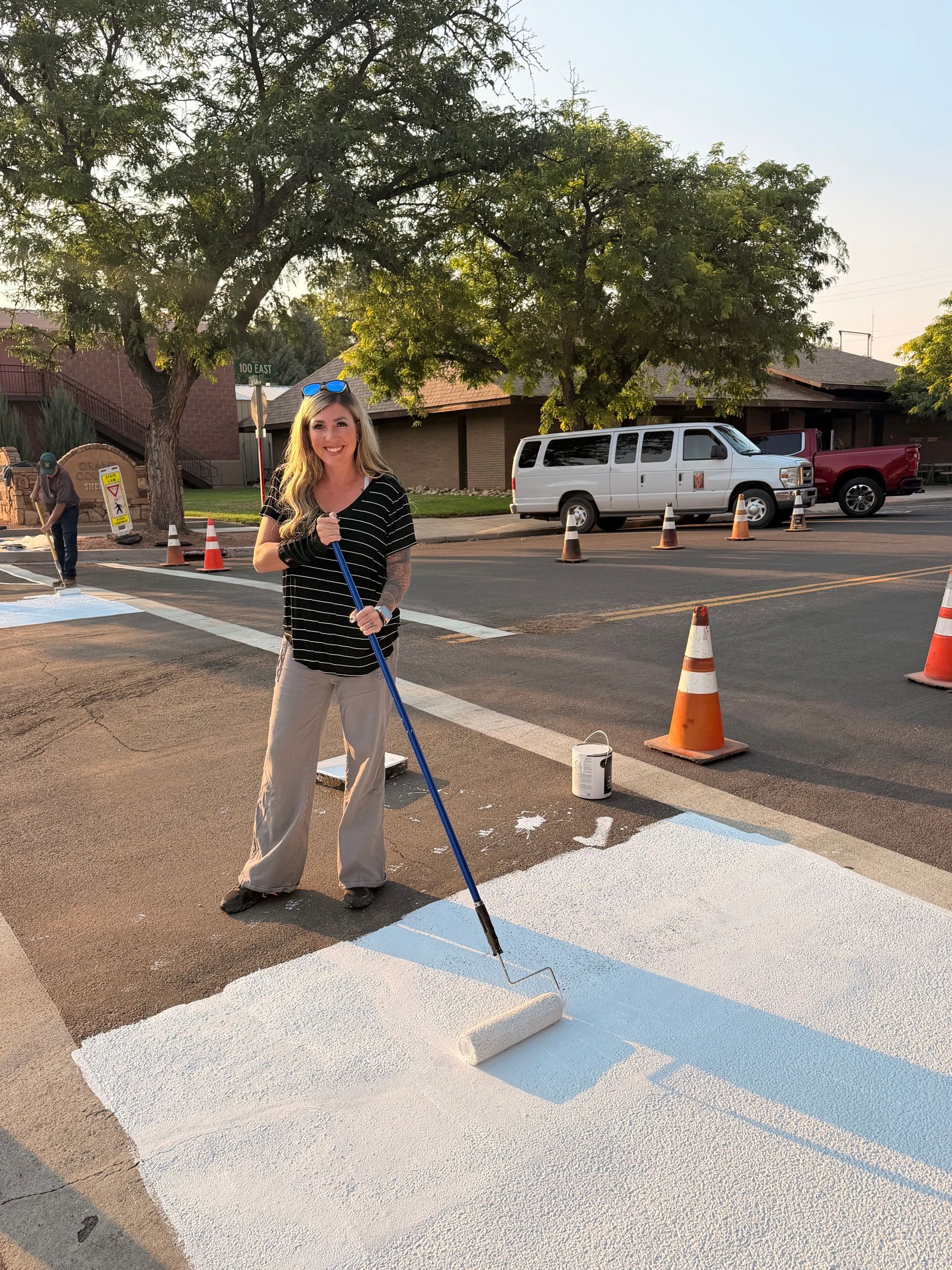Shalee Holland volunteering on a community painting project in downtown Moab